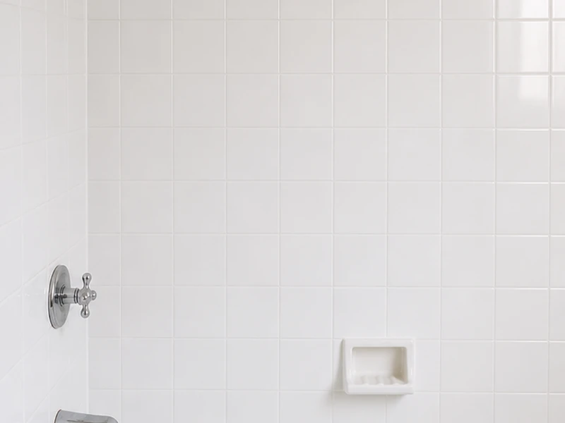 The same wall tile after reglazing, clean glossy white with crisp grout, the Richmond District, San Francisco